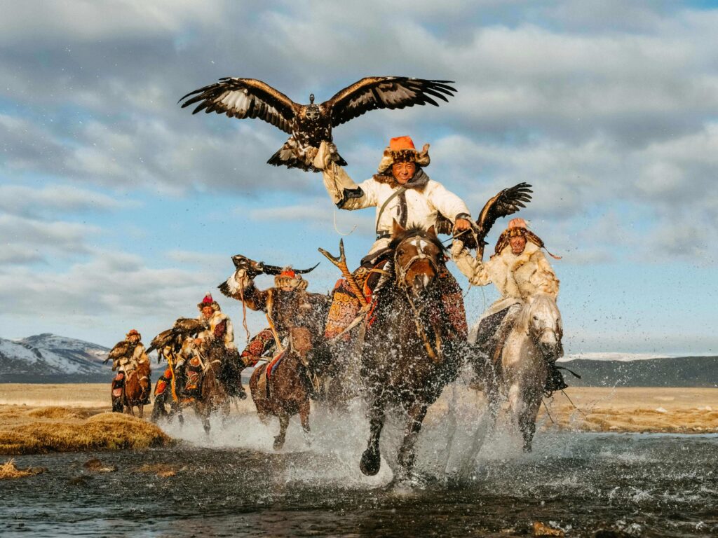 Horseback riders crossing the Orkhon River in Central Mongolia