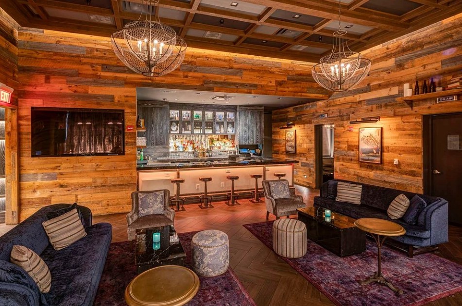 Chic lounge bar aglow with reclaimed wood at The Diplomat Beach Resort Hollywood