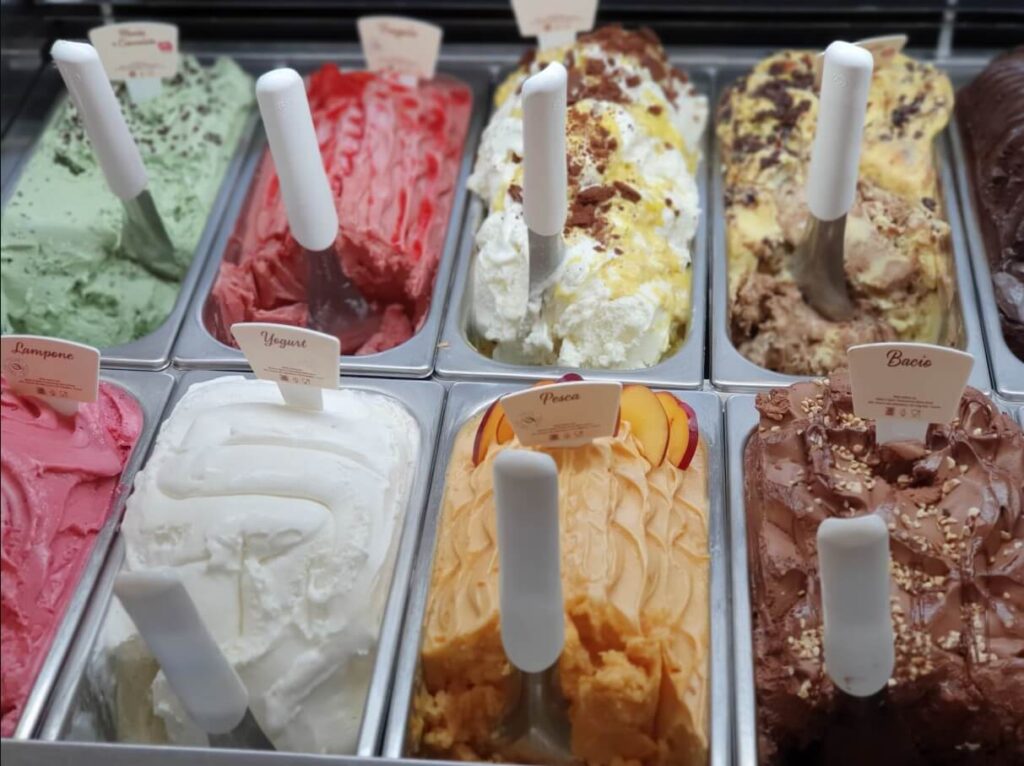 Creamy gelato flavors displayed in chilled pans at Little Man Ice Cream in Denver