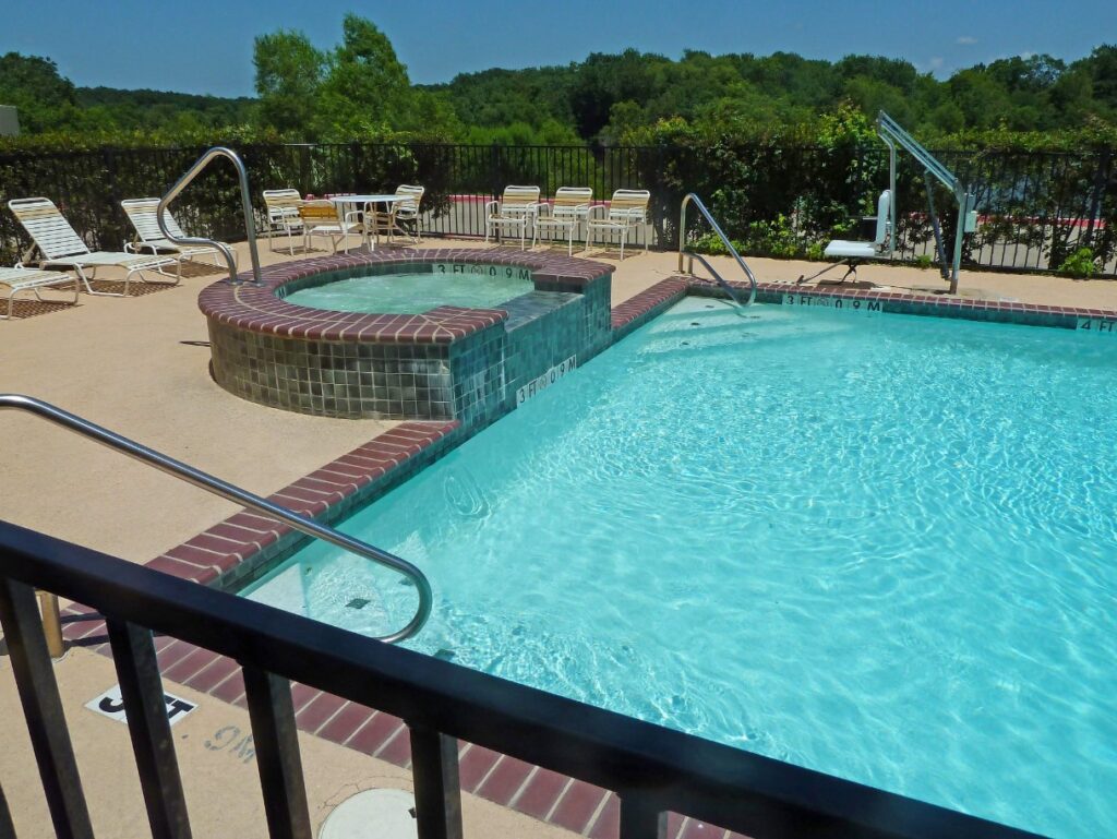 Crystal-clear pool and spa at Americas Best Value Inn & Suites, Gun Barrel City, Texas