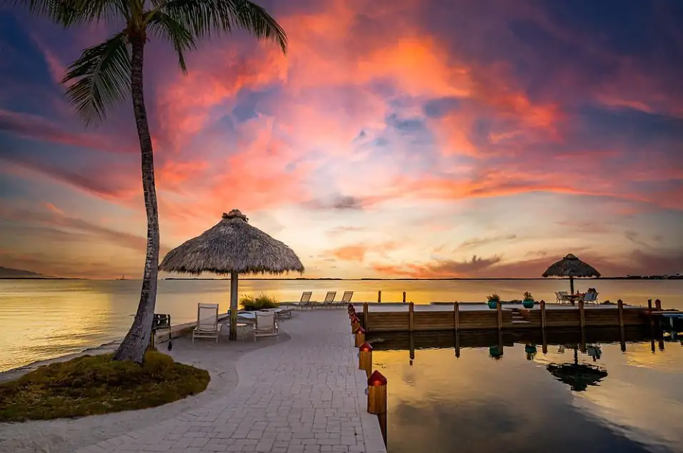 Kona Kai Resort’s oceanfront dock with thatched lounge huts