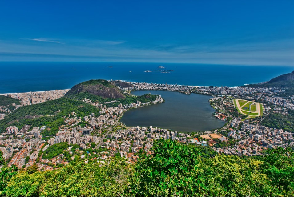 Lagoa Rodrigo de Freitas framed by Rio’s skyline and the Atlantic beyond.