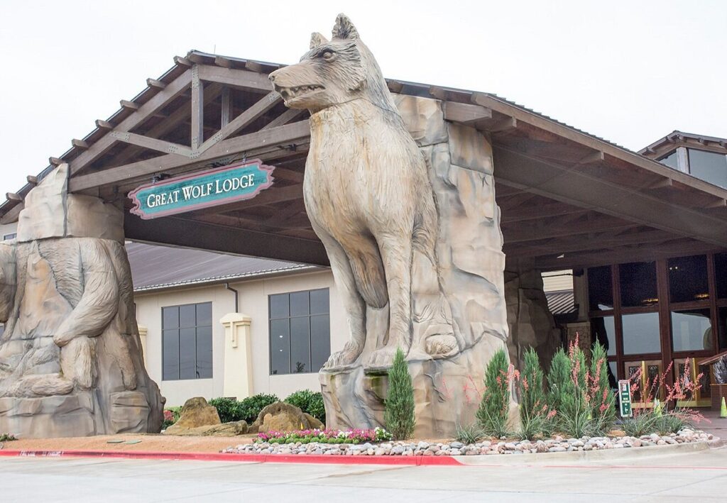 Majestic wolf statues flanking the entrance at Great Wolf Lodge in Grapevine, Texas