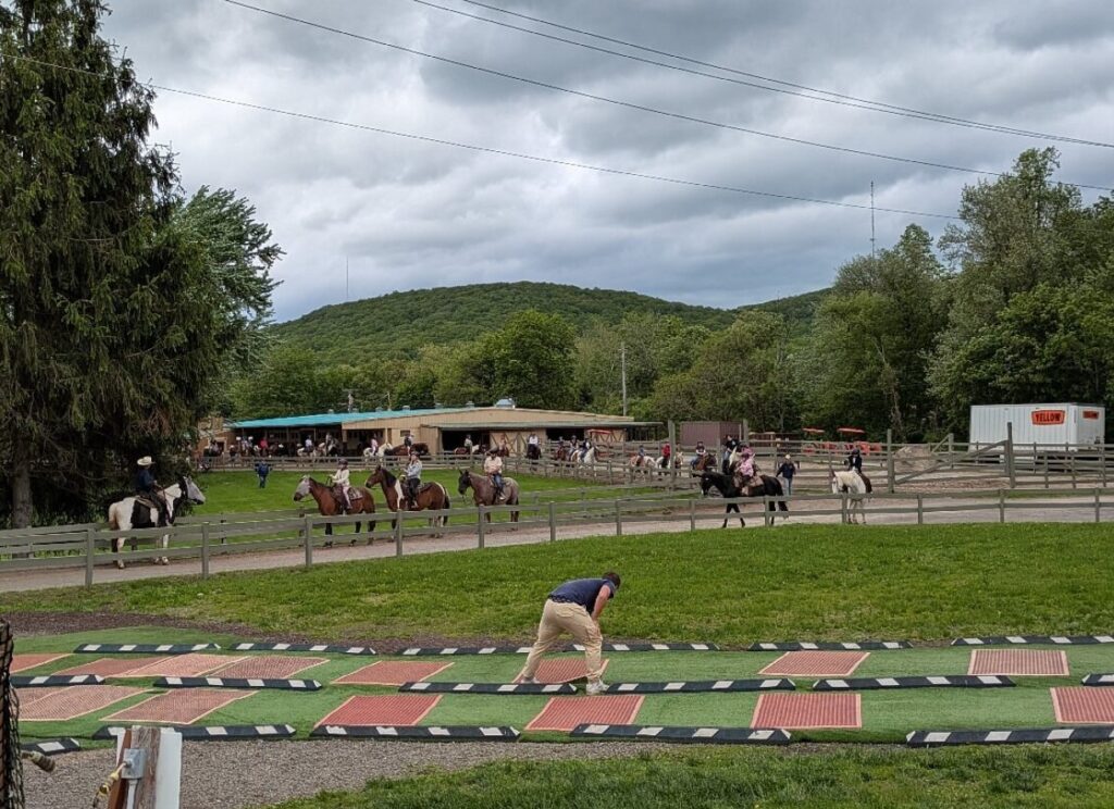 Rocking Horse Ranch’s guest winding a stone labyrinth path under open skies