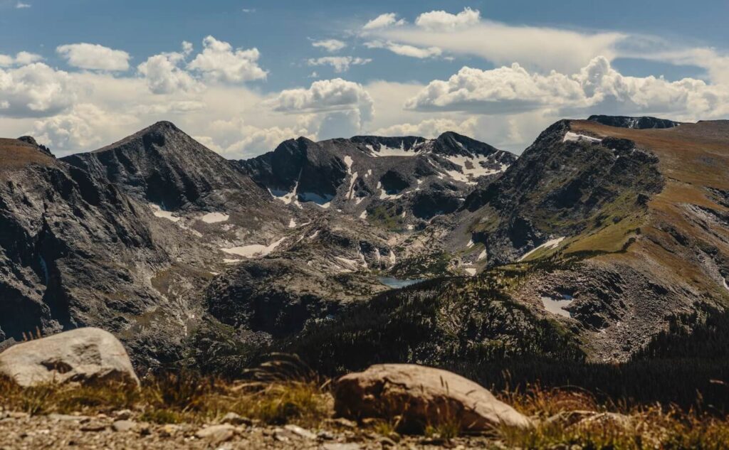 Rugged alpine summits encircling glacial lakes under a dramatic sky in Rocky Mountain National Park