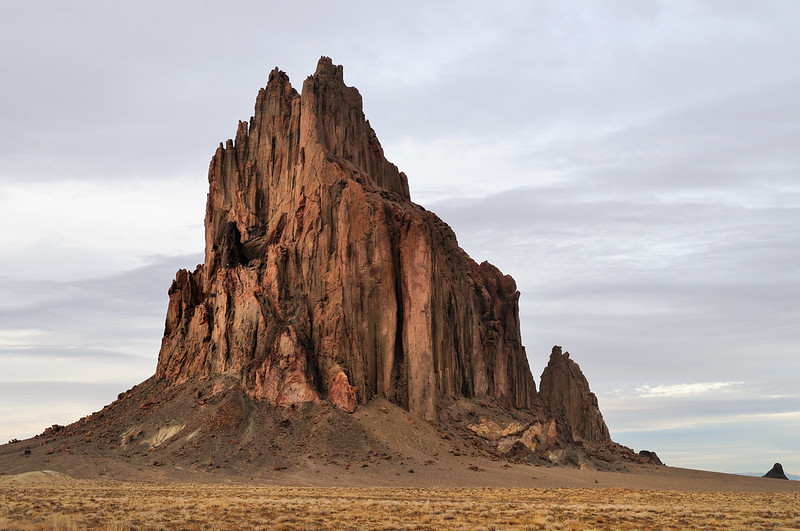 Sacred volcanic spire Shiprock rises stark over Navajo desert