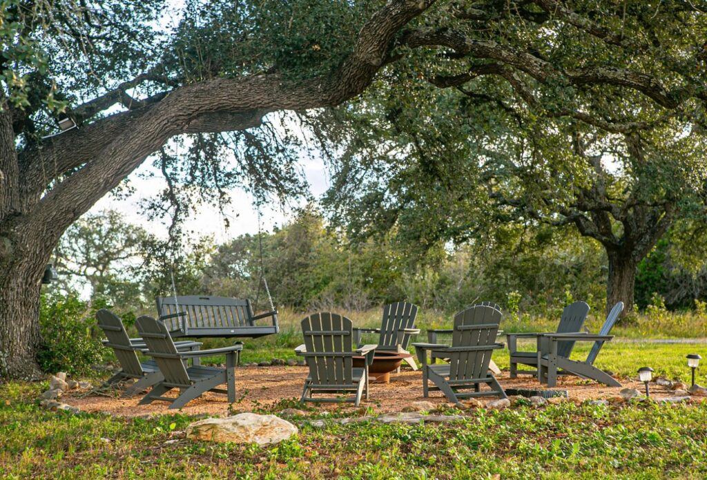 Tranquil riverbank terrace at Sage Hill Inn & Spa overlooking the Texas Hill Country