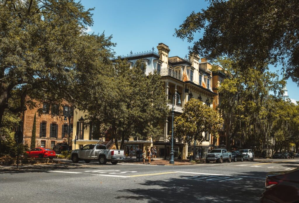 Victorian façades and moss-draped oaks lining one of Savannah’s sun-splashed streets