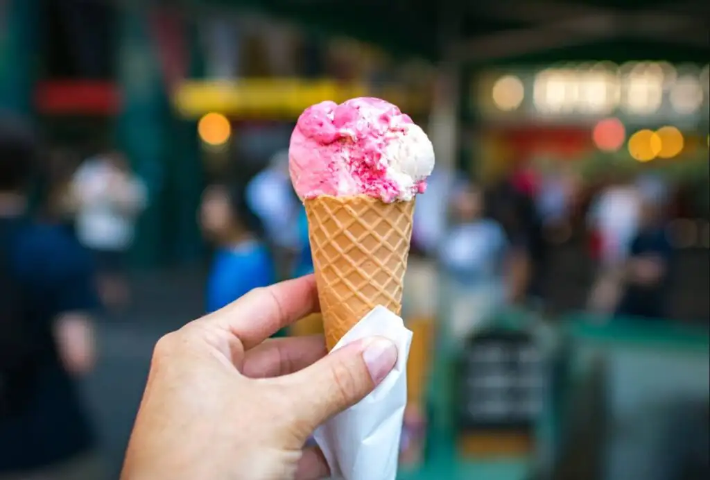 Waffle cone crowned with pink-and-white scoops at The Sugar Shack
