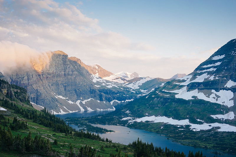 Golden light spills across alpine ridges above Hidden Lake in Glacier National Park, Montana