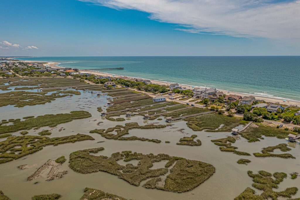 Marshfront homes and tidal creeks frame the serene shoreline of Pawleys Island, South Carolina