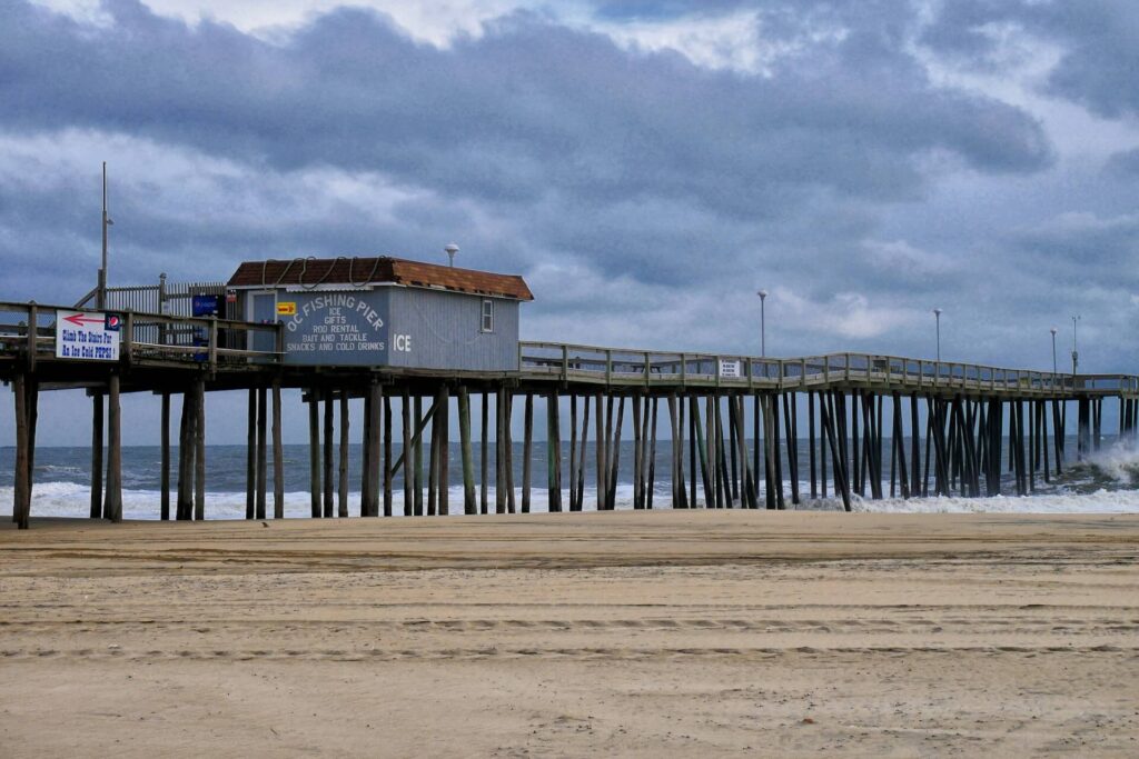 Rolling surf breaks against the iconic fishing pier at Ocean City, Maryland