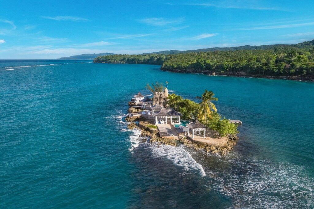 Stone turrets and white cabanas crown a private islet at Couples Tower Isle, Jamaica