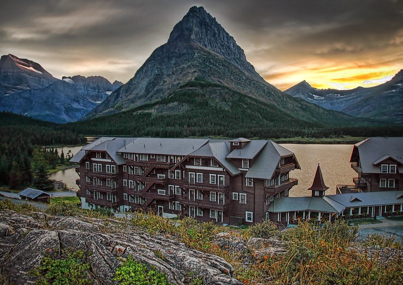 Timber-framed elegance rests beside Swiftcurrent Lake at Many Glacier Hotel, Montana
