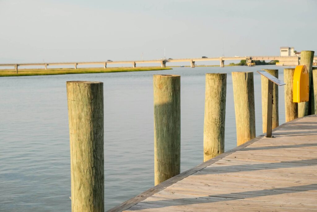 Wooden pilings line the peaceful inlet at Chincoteague, Virginia