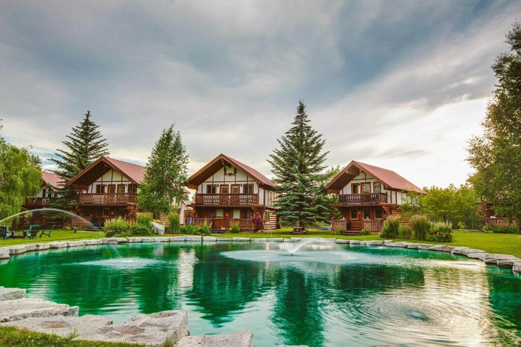 Scenic pond reflections at Great Northern Resort beside its quaint cabins