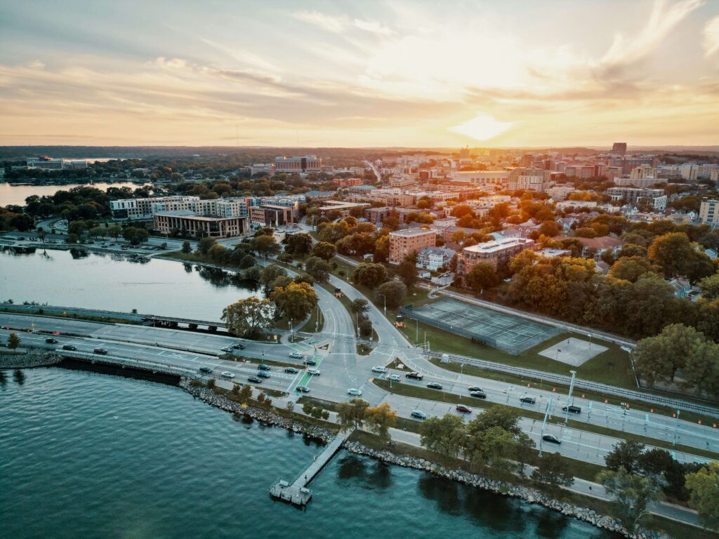 Sunset over Madison, Wisconsin — city lights and skyline glow.