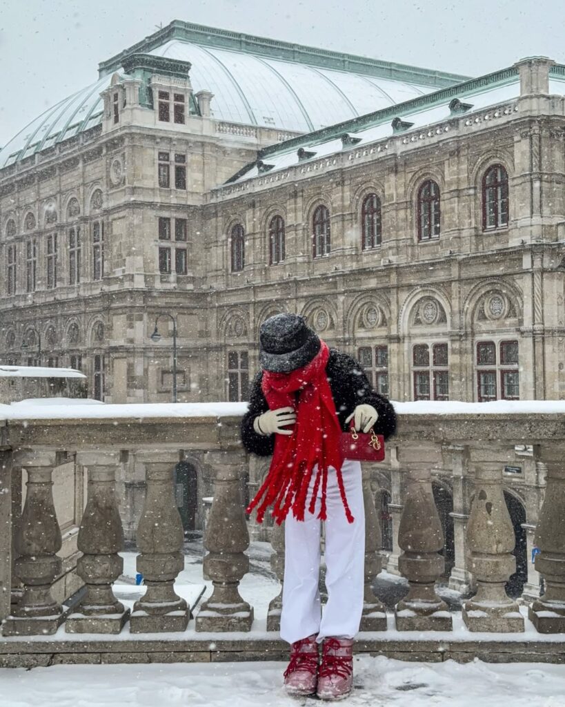 Bold red scarf, cozy layers, and winter elegance