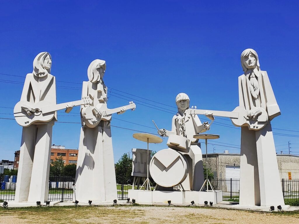 Giant Beatles Statues Find Houston’s Oversized Fab Four